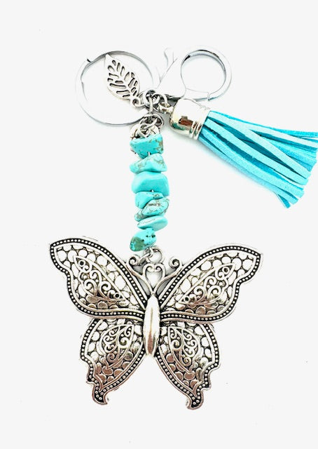 Großhandel Schmetterling-Schlüsselanhänger mit Türkis-Steinen &amp; Türkis Quaste